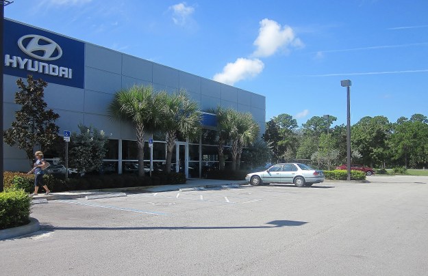 Scope of Work - Auto Dealership: Clearing, mass earthwork, and initial site preparation for construction. Installation of all underground utilities and drainage. Sub-grade and building pad, prep and install all asphalt, concrete parking and landscaping.